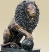 Seated Lions with Ball on Pedestal bronze sculpture