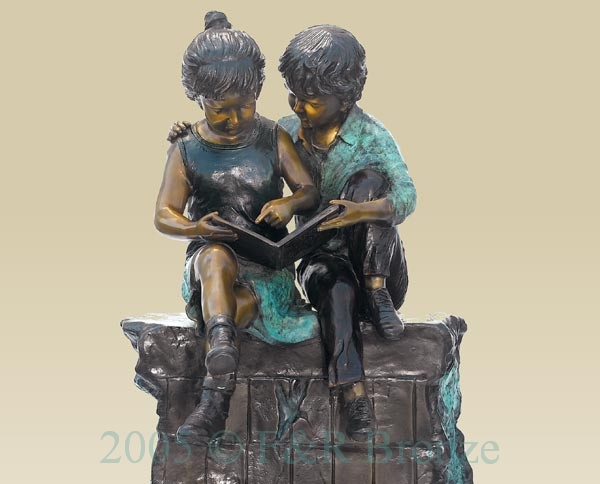 Boy and Girl Reading On Wall bronze 