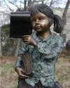 Girl Sitting on Globe Reading Sculpture