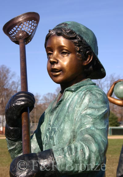 Boy Playing Lacrosse bronze sculpture-1
