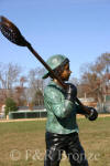 Boy Playing Lacrosse bronze sculpture