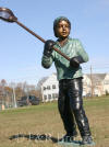 Lacrosse Boy bronze statue
