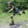 Rollerblading Boy bronze statue