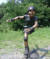 Boy Rollerblading bronze sculpture