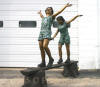 Two Kids Walking On Board Bronze Statue