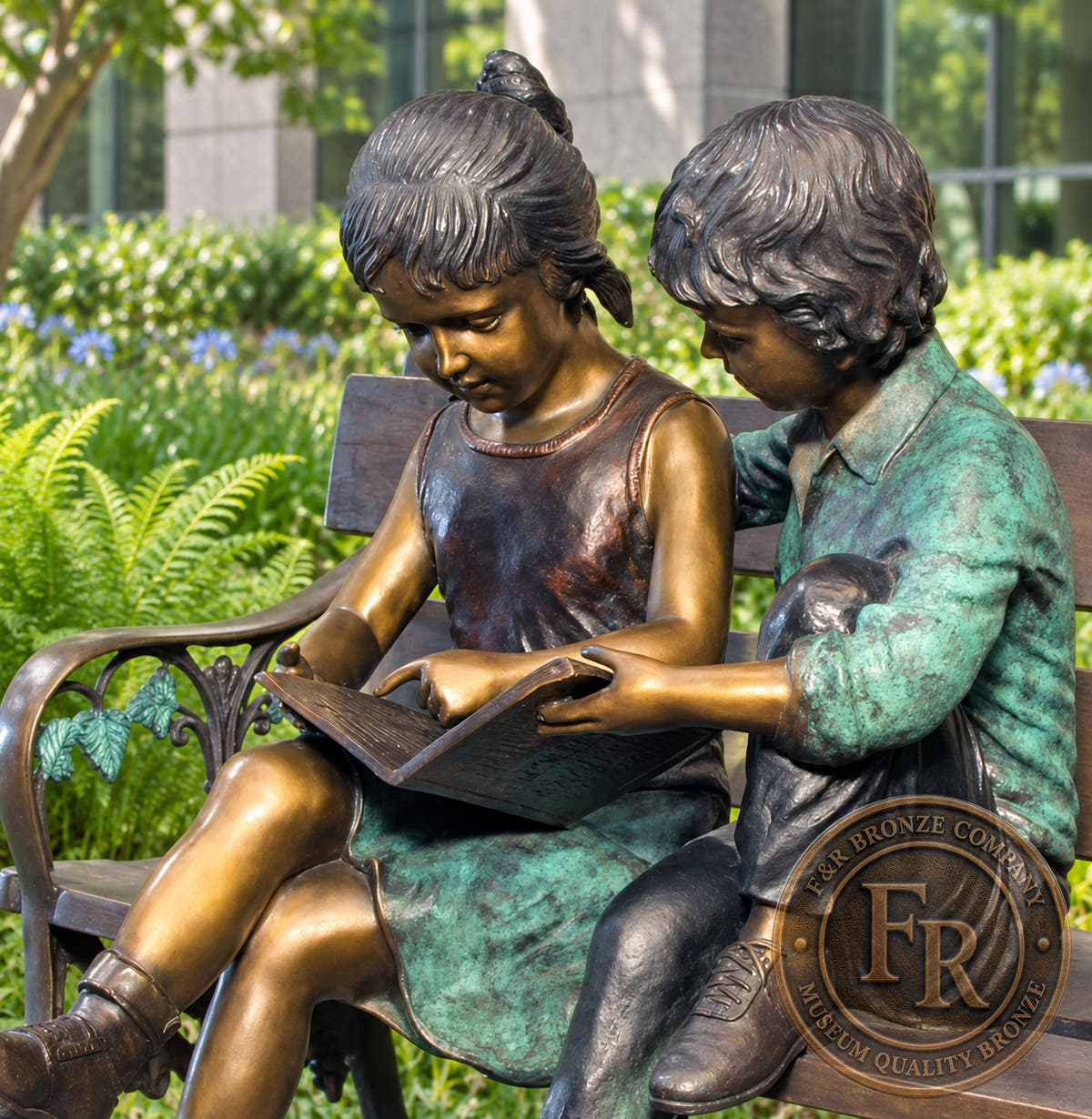 Children’s library concept detail of the two children reading bronze sculpture, showing their expressions and shared book.