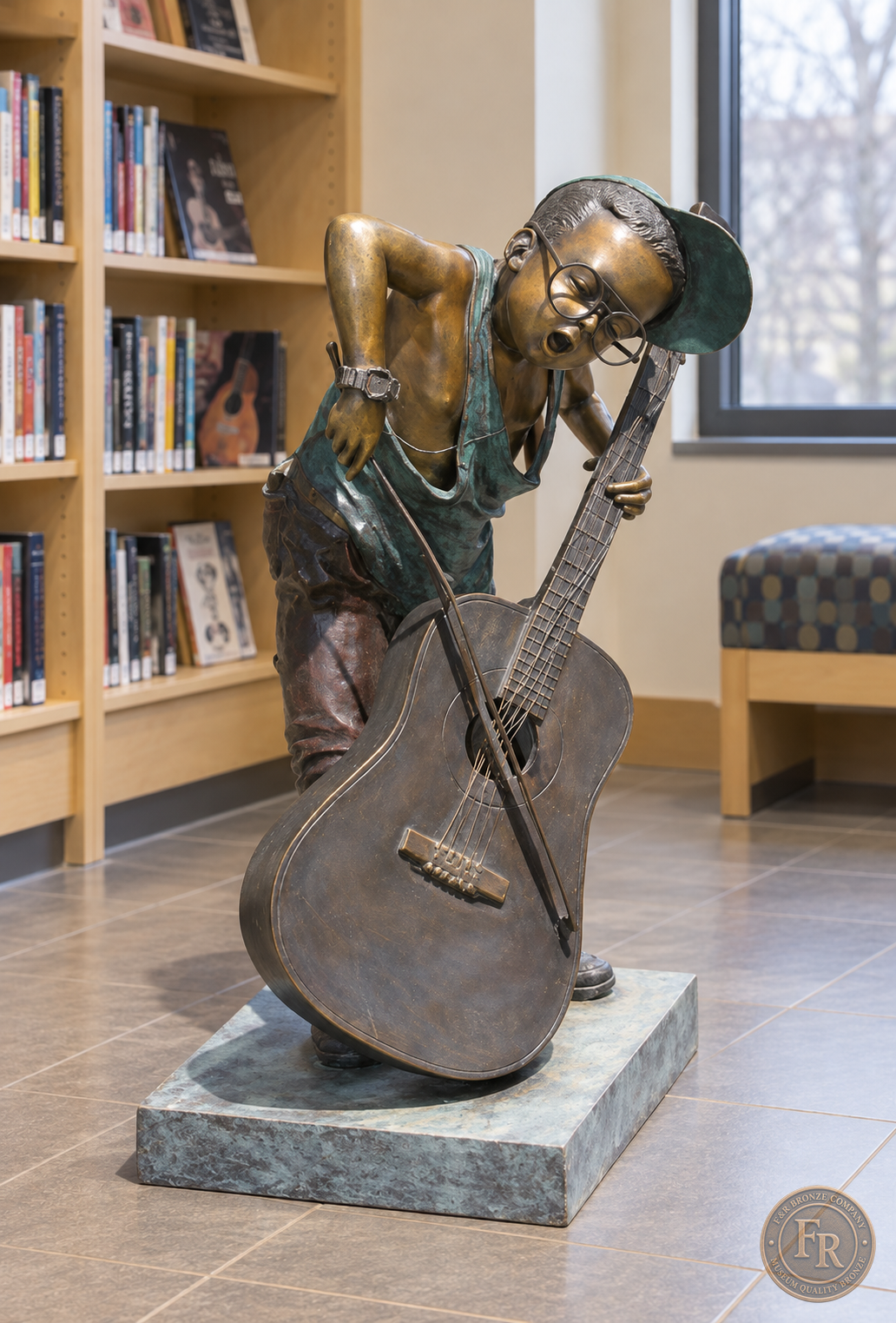 Jumbo Boy Playing Guitar Bronze Statue, item 806, alternate front, in a modest contemporary library setting. Placement concept based on the owner-supplied product photograph.