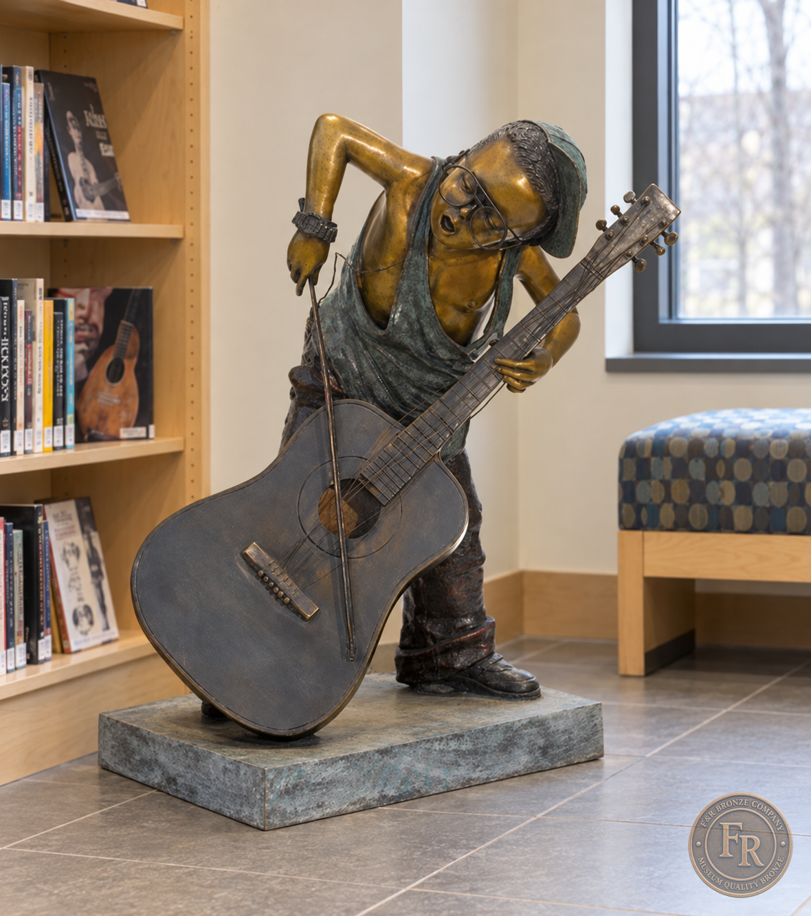 Jumbo Boy Playing Guitar Bronze Statue, item 806, front studio angle, in a modest contemporary library setting. Placement concept based on the owner-supplied product photograph.