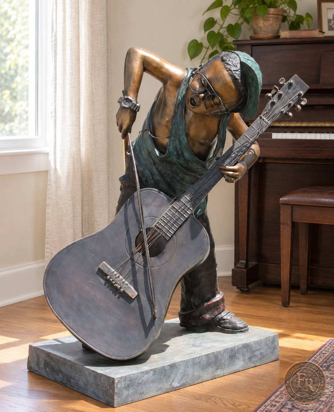 Jumbo Boy Playing Guitar Bronze Statue, item 806, front, in a modest indoor music room setting. Placement concept based on the owner-supplied product photograph.