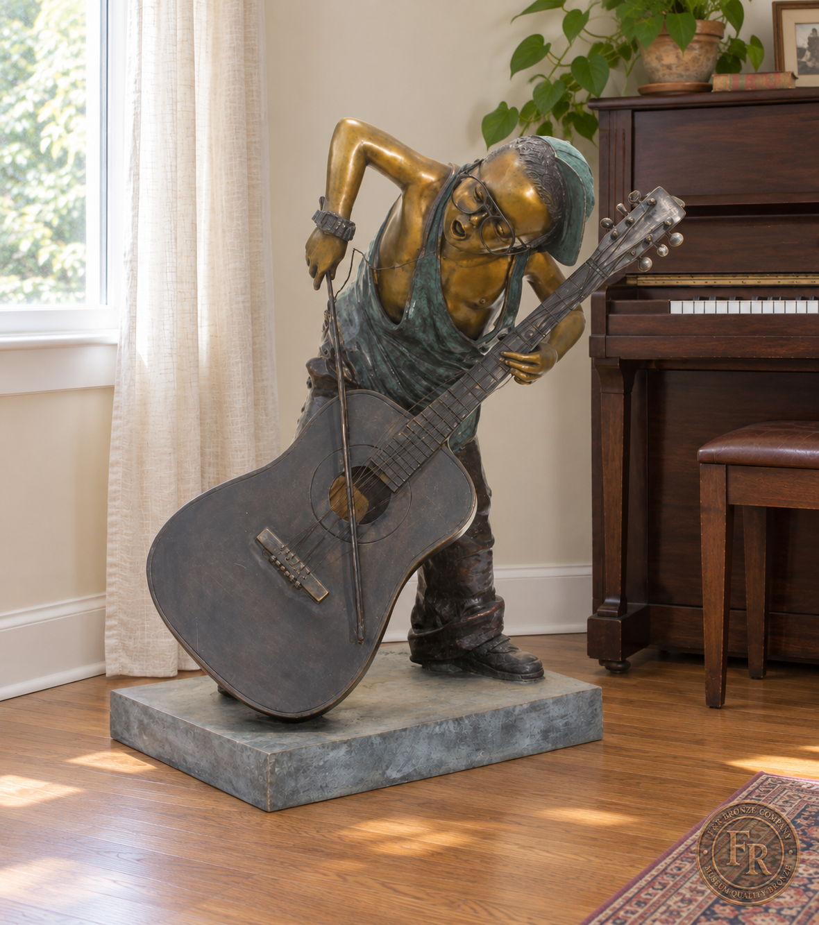 Jumbo Boy Playing Guitar Bronze Statue, item 806, front studio angle, in a modest indoor music room setting. Placement concept based on the owner-supplied product photograph.