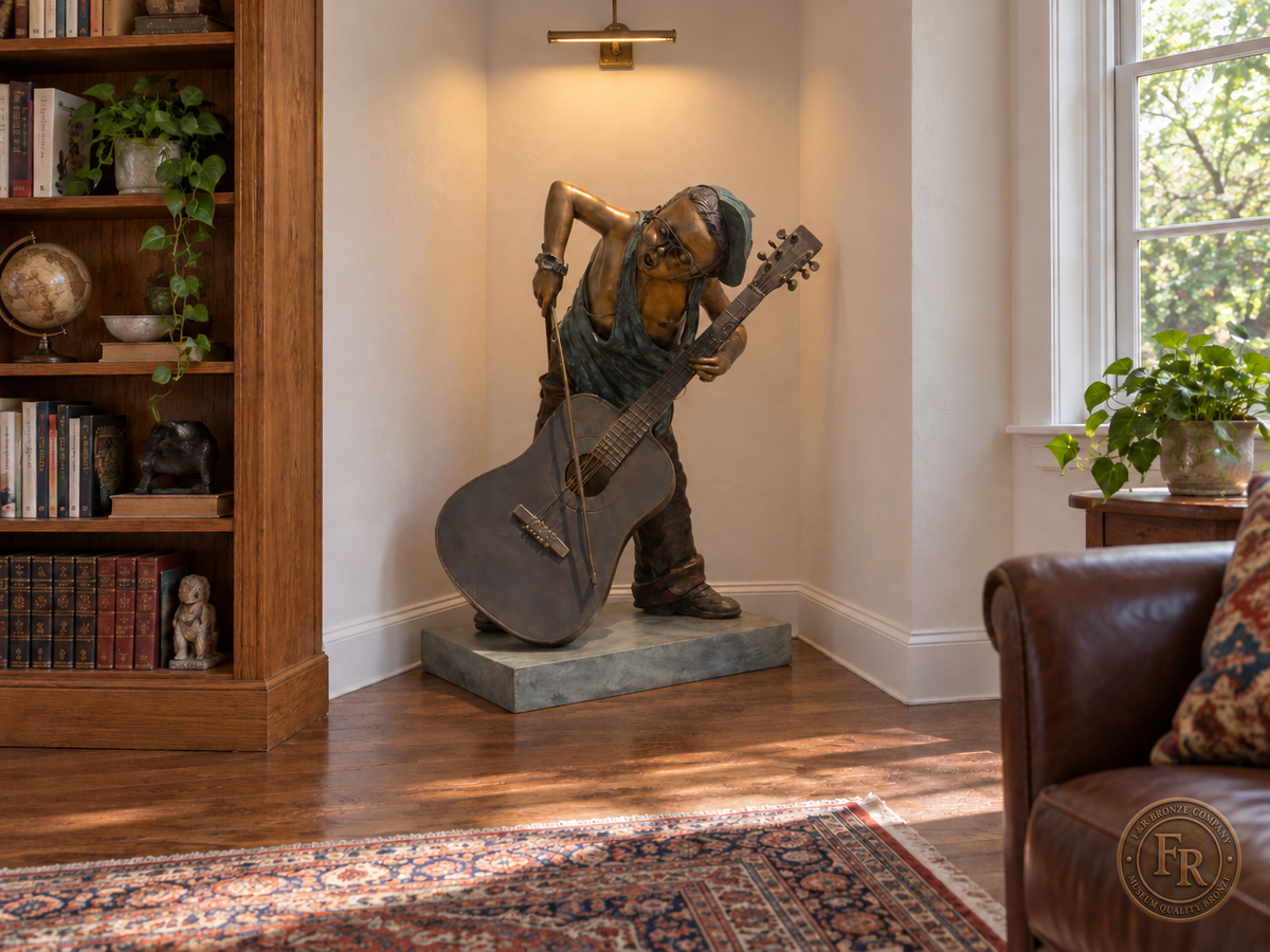 Boy musician bronze sculpture, alternate front view, placed in a library corner beside a bookcase with its original base and clear walking space.