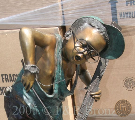 Original face detail photograph of Jumbo Boy Playing Guitar Bronze Statue, item 806, F&R Bronze.