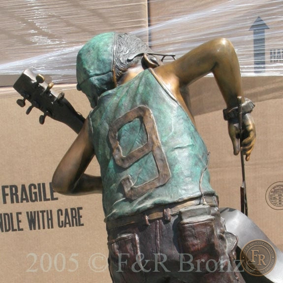 Original rear detail photograph of Jumbo Boy Playing Guitar Bronze Statue, item 806, F&R Bronze.