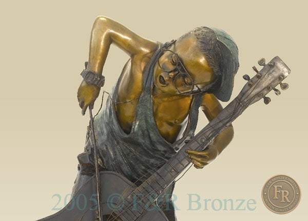 Original studio upper front photograph of Jumbo Boy Playing Guitar Bronze Statue, item 806, F&R Bronze.
