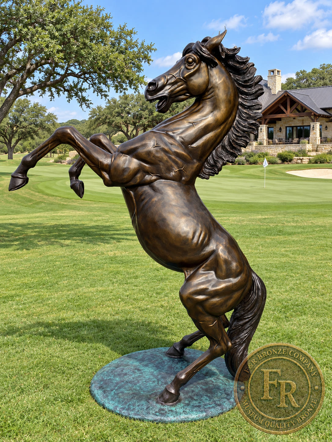 Full view of a rearing stallion bronze sculpture in a ranch landscape architectural concept.