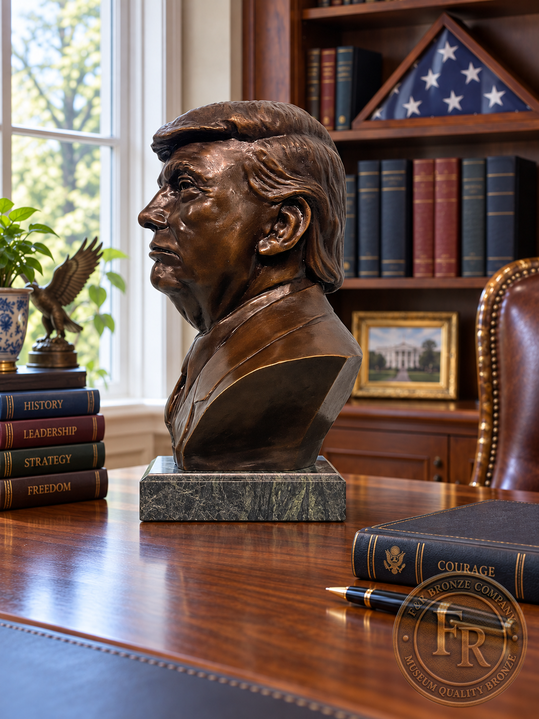 Wide left-profile view of a Donald J. Trump presidential bronze bust on a walnut office desk beside books.