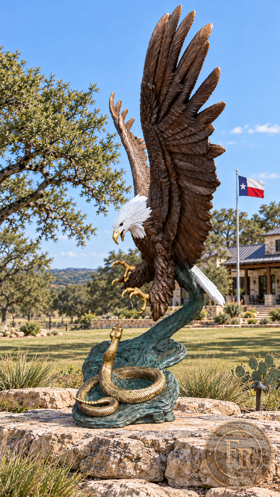 Side view of the eagle and rattlesnake bronze sculpture in a ranch landscape, with raised wings and talons above the coiled snake.