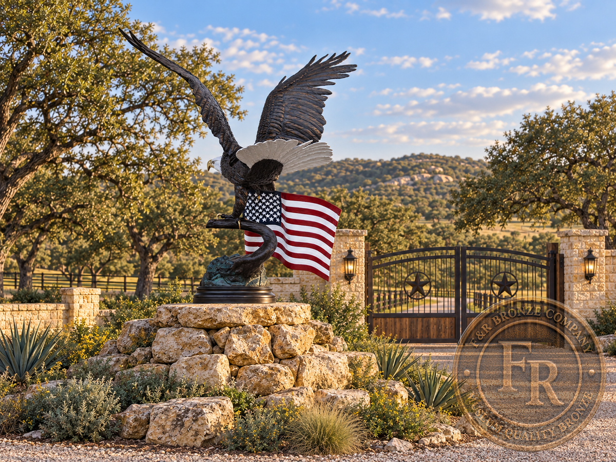 Rear view of the eagle with American flag bronze statue and layered wing feathers in a Texas ranch gate architectural concept.