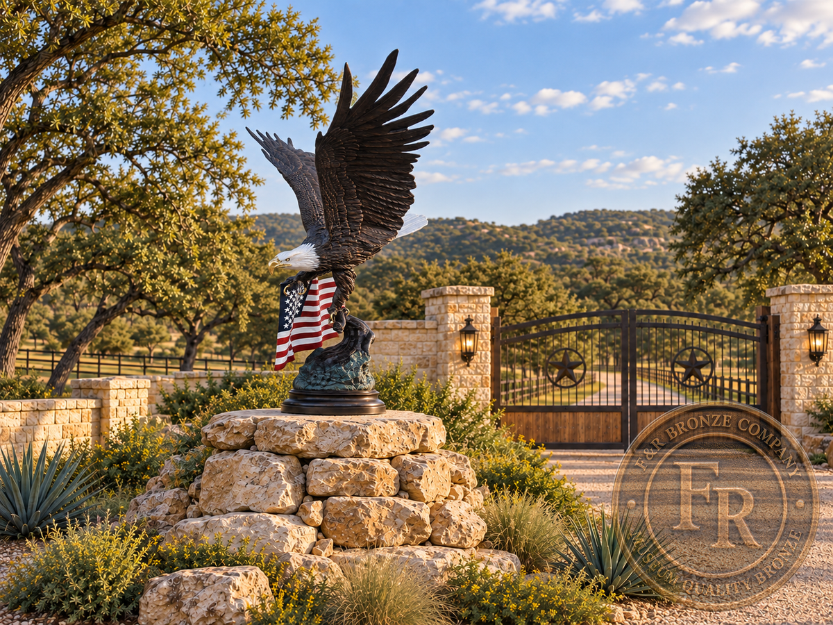 Side architectural concept of the bronze bald eagle with raised wings and American flag at a Texas ranch gate.