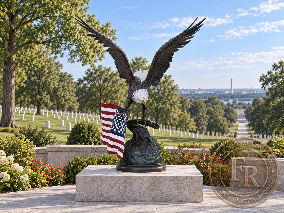 Front view of the American flag eagle bronze statue on a rectangular pedestal in a cemetery memorial architectural concept.