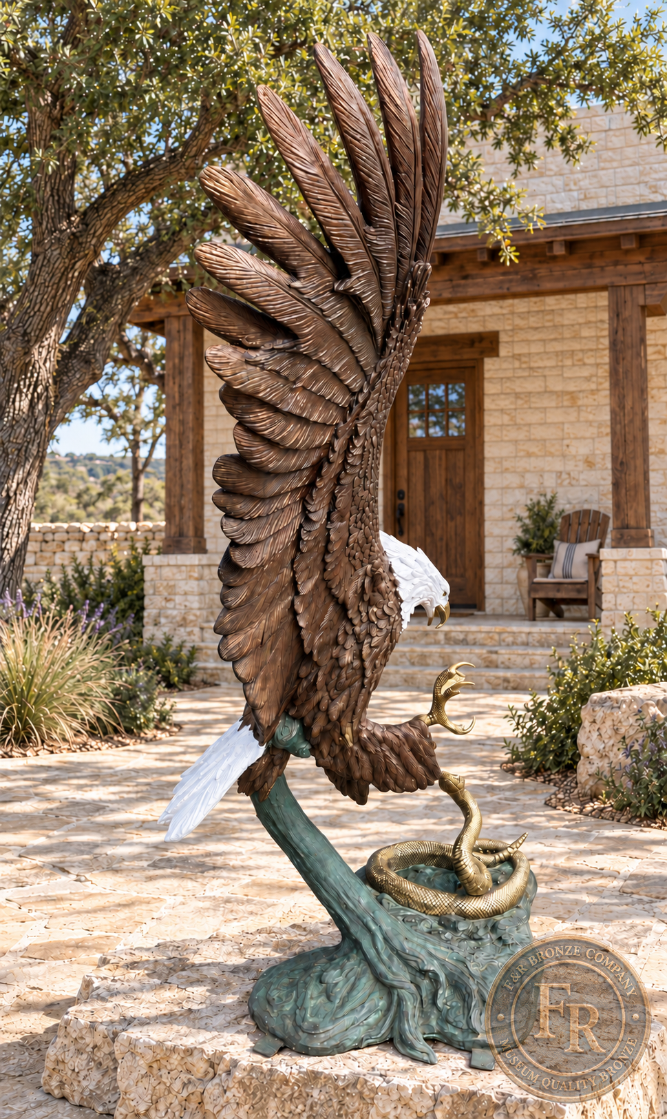 Right-side view of the eagle fighting a rattlesnake bronze statue, showing tall wing feathers, white tail and green patinated base.