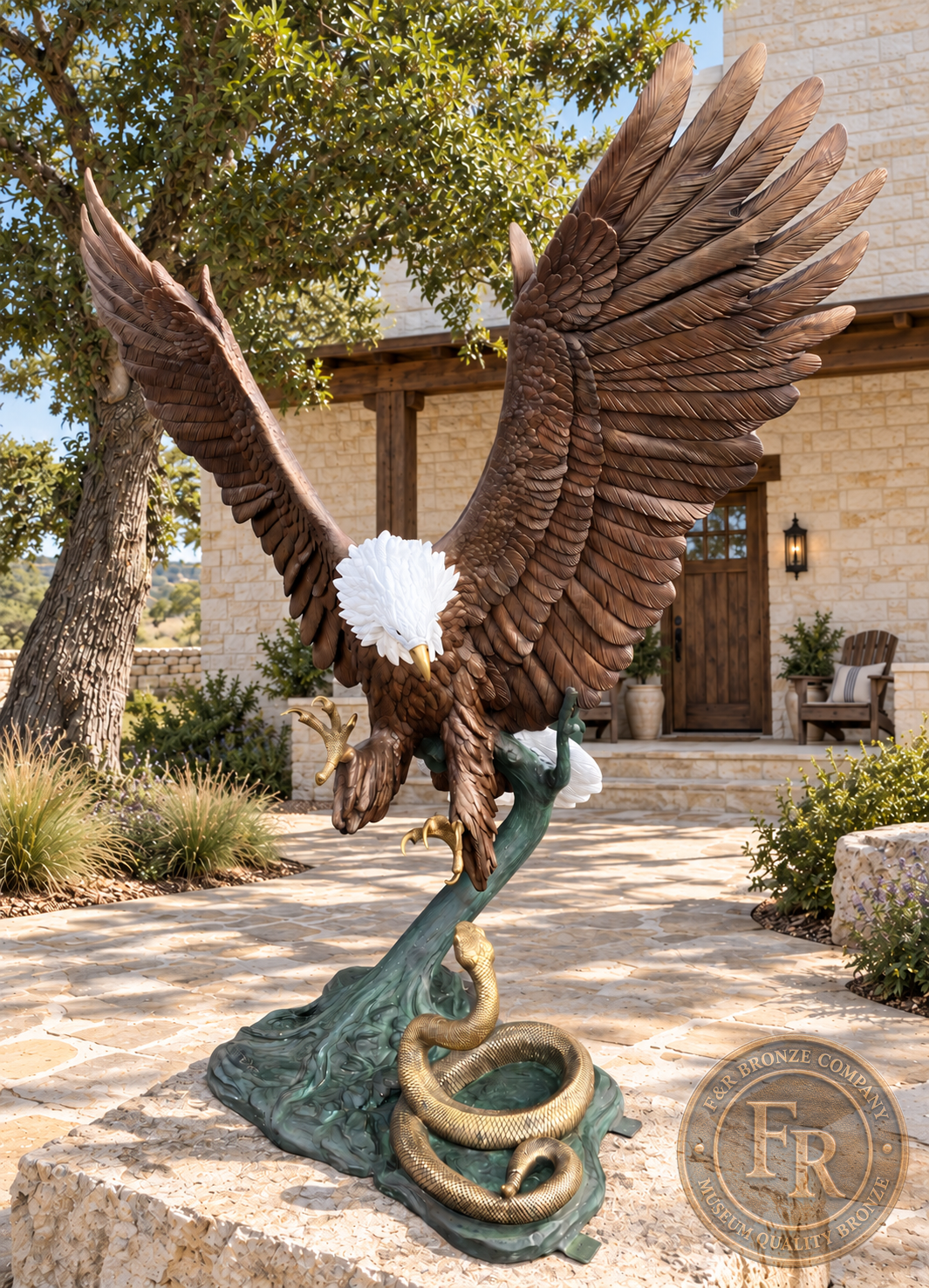 Three-quarter view of the eagle with snake bronze sculpture, showing layered wing feathers, extended talons and a coiled rattlesnake.