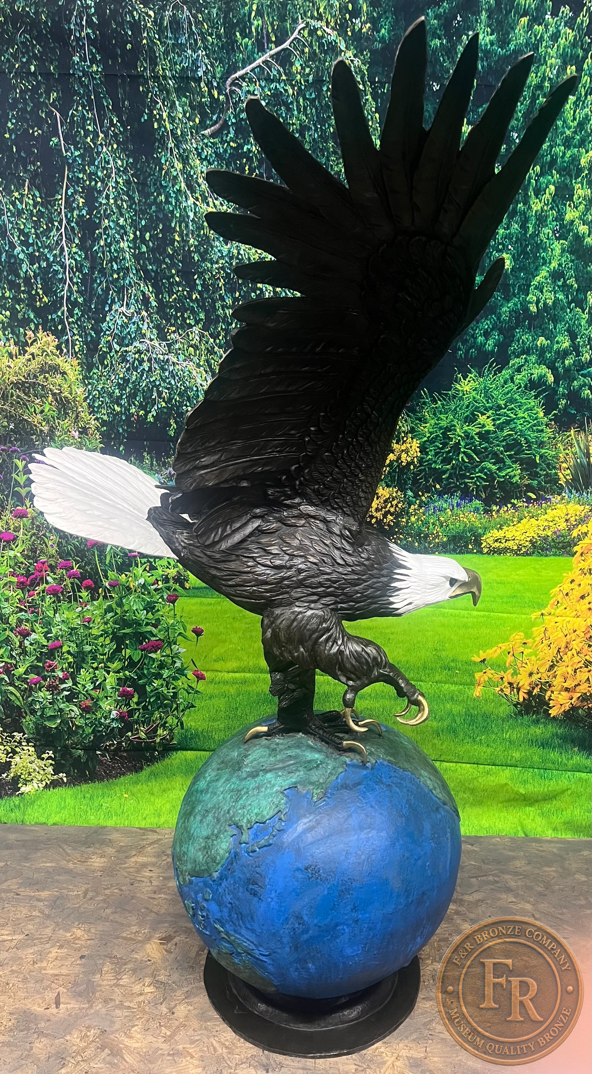 Original right-side photograph of the eagle on globe bronze sculpture, showing modeled feathers, extended talons and globe.