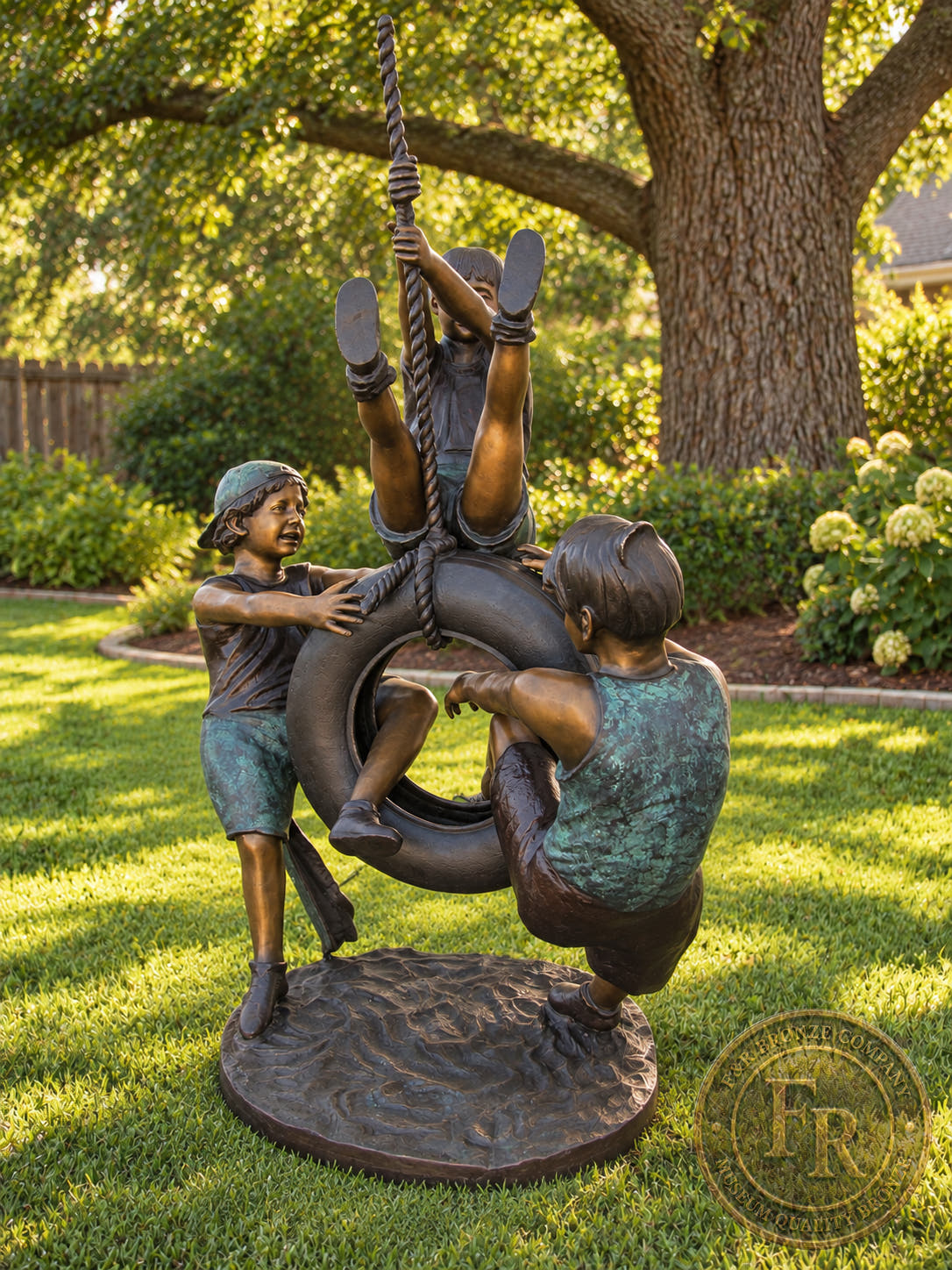 Three Kids Playing with Tire Swing bronze statue by Max Turner, alternate front view showing all three children and the sculpted base.