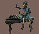 little girl reading to her little brother bronze sculpture