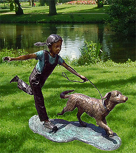 Little girl running with dog bronze