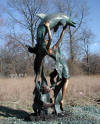 Lady with Dolphin Jumping Overhead bronze