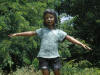 Four Kids on Logs bronze sculpture