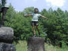 Four Kids on Logs with a dog bronze reproduction