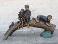 Three Kids & squirrel on log bronze sculpture