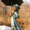 Girl holding Umbrella bronze