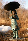 Girl holding Umbrella bronze statue