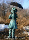 Girl holding Umbrella bronze statue