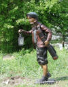 Caddy Holding Lantern bronze statue