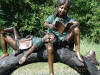 Boy & Girl Reading On Tree Branch bronze sculpture