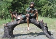 Boy & Girl Reading On Tree Branch bronze sculpture