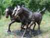 Triple Horses bronze sculpture table with glass