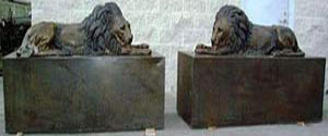 Left & Right Lions Laying Down On Pedestal Bronze
